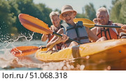 Multiple individuals enjoy a ride on a vibrant yellow kayak, cruising through the water and having a fun time together. Стоковое AI-видео, аниматор Данила Большаков / Фотобанк Лори