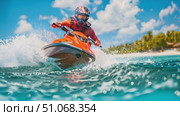 A man skillfully navigates a jet ski across the water, creating splashes and waves as he maneuvers through the open expanse. Стоковое AI-видео, аниматор Данила Большаков / Фотобанк Лори