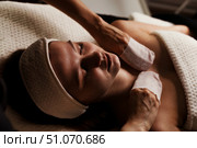 Relaxing Massage Experience for Rejuvenation and Tranquility During a Soothing Indoor Session. Стоковое фото, фотограф Aleksandr Golubev / Фотобанк Лори
