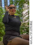 Woman in black outfit and sunglasses outdoors. Стоковое фото, фотограф Виктор Ветошкин / Фотобанк Лори