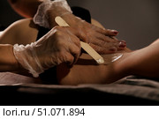 Waxing Away Unwanted Hair For Smooth Skin In Professional Setting. Стоковое фото, фотограф Aleksandr Golubev / Фотобанк Лори