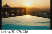 Enjoy a breathtaking sunset as the sun sets behind mountains at a serene location. Стоковое AI-видео, аниматор Данила Большаков / Фотобанк Лори