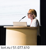 Female speaker giving a talk on corporate business conference. Business and Entrepreneurship event. Стоковое фото, фотограф Matej Kastelic / Фотобанк Лори