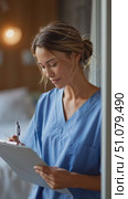 Nurse smiling in a hospital setting while holding a clipboard during a morning shift. Стоковое AI-видео, аниматор Сергей Толмачёв / Фотобанк Лори