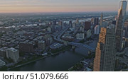 City skyline, sprawling, representing urban landscape. Стоковое AI-видео, аниматор Наталия Дидковская / Фотобанк Лори