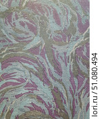A close-up of a textured fabric with an abstract pattern in soft pastel tones. The main background is made in a soft lilac color with a slight matte effect. On top is a relief pattern in the form of smooth, wavy lines and strokes reminiscent of feathers or plant motifs. The ornament is made in a combination of silver, gray-blue and light turquoise shades, creating an effect of overflows when the angle of lighting changes. The fabric has a distinct texture with interlacing threads, which gives the image depth and richness of detail. Such material can be used for upholstery of furniture, making curtains, decorative panels or accessories in the interior. Стоковое фото, фотограф Анна Кривицкая / Фотобанк Лори