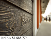 Modern brown wood plank texture. Fiber cement siding. Exterior of composite wall. Plastic material is eco-friendly polymer panels in rows. Wooden grain surface. Hollow WPC boards. Dark oak color. PE. Стоковое AI-изображение, AI-художник Марина Демидюк / Фотобанк Лори