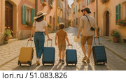 A family walks down a cobblestone street, pulling suitcases. The scene features colorful buildings and a sunny atmosphere. They appear excited for their journey. Стоковое AI-видео, аниматор Nart / Фотобанк Лори