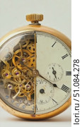 Antique pocket watch with a transparent cover revealing intricate golden gears and mechanisms. The watch features Roman numerals and a vintage design. Стоковое AI-видео, аниматор Nart / Фотобанк Лори