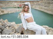 Fashion portrait of young beautiful woman posing in quarry. Стоковое фото, фотограф Андрей Аркуша / Фотобанк Лори