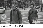 A group of diverse people crossing a city street. A senior Caucasian man in a suit, a young Hispanic man with a backpack, and two young Asian men walk together. Стоковое AI-видео, аниматор Nart / Фотобанк Лори