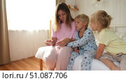 Mum is cutting nails to her son by Clippers. Mother use Nail Trimmer for cutting tiny fingernails of little son. Kid boy hand. Child care. Clip nails. Closeup. Children hygiene. Clipping Child's Nails. Стоковое видео, видеограф Марина Демидюк / Фотобанк Лори