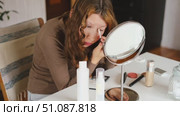 Teen Girl putting on makeup looking at mirror. Beautiful Teenager caring her face. 14 years old female applied cosmetics. Natural beauty concept. Skin care, make-up. Daily make up. Beautiful Teenage. Стоковое видео, видеограф Марина Демидюк / Фотобанк Лори