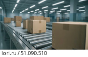Boxes moving on a conveyor belt in a modern warehouse. The scene shows an automated sorting system for efficient logistics and shipping processes. Стоковое AI-видео, аниматор Nart / Фотобанк Лори
