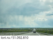 M4 Highway Russia - May 10, 2022: Road section and rain clouds ahead. Редакционное фото, фотограф Наталия Кирсанова / Фотобанк Лори