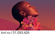 Bold black woman adorned with tropical flowers embodies summer fashion in a vibrant setting. Стоковое AI-изображение, AI-художник Ксения Лаптева / Фотобанк Лори