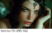 Enigmatic elf character in dark fantasy setting with striking blue eyes and intricate jewelry. Стоковое AI-изображение, AI-художник Ксения Лаптева / Фотобанк Лори