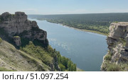Video of natural landmark - steep White Cliffs along bank of Siberian Belaya River, near village of Kholmushino, Usolye-Sibirskoye district, Irkutsk region. Beautiful summer landscape. Natural background. Стоковое видео, видеограф Виктория Катьянова / Фотобанк Лори