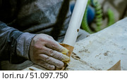 carpenter using nail gun or brad nailer tool on wood box in a workshop ,furniture restoration woodworking concept. selective focus. Стоковое фото, фотограф Feruza Tashmetova / Фотобанк Лори