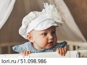 Daydreaming Little Darling Looks out From Her Crib in the Nursery. Стоковое фото, фотограф Aleksandr Golubev / Фотобанк Лори