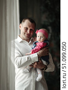 Cherished Moment With Daddy Dearest Holding Precious Baby Girl. Стоковое фото, фотограф Aleksandr Golubev / Фотобанк Лори