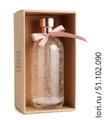 A bottle of perfume is in a box with a pink ribbon. Стоковое фото, фотограф Ярославский Максим / Фотобанк Лори