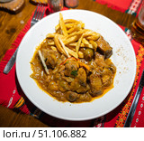 Stewed pork meat with potatoes and gravy. Traditional Bulgarian dish. Стоковое фото, фотограф Яков Филимонов / Фотобанк Лори