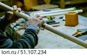 carpenter using nail gun or brad nailer tool on wood box in a workshop ,furniture restoration woodworking concept. selective focus. Стоковое фото, фотограф Feruza Tashmetova / Фотобанк Лори