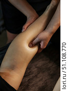 Relieving Tension Skilled Hands Knead Calf Muscles in Spa Treatment. Стоковое фото, фотограф Aleksandr Golubev / Фотобанк Лори