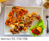 Fried shrimp, octopus and other seafood on plate. Стоковое фото, фотограф Яков Филимонов / Фотобанк Лори