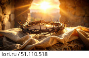 Crown of thorns placed on fabric in sunlight conveys Christian symbolism, sacrifice, Easter tradition, faith, and the universal message of suffering, redemption, and hope. Стоковое AI-изображение, AI-художник Ольга Сухарева / Фотобанк Лори