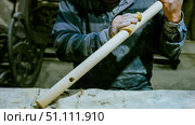 carpenter using nail gun or brad nailer tool on wood box in a workshop ,furniture restoration woodworking concept. selective focus. Стоковое фото, фотограф Feruza Tashmetova / Фотобанк Лори