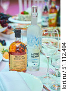 Krasnodar, Russia - July 17, 2022: Bottles of alcohol vodka and whiskey of European production. Mont blanc and Monkey Shoulder. Редакционное фото, фотограф Наталия Кирсанова / Фотобанк Лори