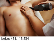Percussion Therapy Eases Muscular Aches in Relaxing Environment. Стоковое фото, фотограф Aleksandr Golubev / Фотобанк Лори
