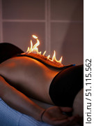 A Therapeutic Fire Massage Treatment at Spa. Стоковое фото, фотограф Aleksandr Golubev / Фотобанк Лори
