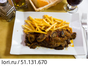 Oven baked pork knuckle with french fries and mushrooms. Стоковое фото, фотограф Яков Филимонов / Фотобанк Лори