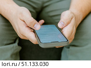 Close-up of a man's hand using AI. Стоковое фото, фотограф Feruza Tashmetova / Фотобанк Лори