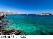 Agios Nikolaos coastline on a sunny day with clear sea and cliffs. (2019 год). Редакционное фото, фотограф Емельянов Евгений Викторович / Фотобанк Лори