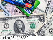 Photo of VISA and Mastercard credit card with USA dollars bills. (2017 год). Редакционное фото, фотограф Емельянов Евгений Викторович / Фотобанк Лори