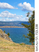 Summer landscape of Baikal Lake on sunny August day. View of Small Sea from Olkhon island coast. Ogoy island on the distanse. Natural background. Summer travels and outdoor recreation. Стоковое фото, фотограф Виктория Катьянова / Фотобанк Лори
