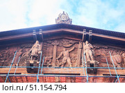 Moscow, Russia - March 24, 2023: Moscow VDNH. The building of one of the pavilions, wood carving. Редакционное фото, фотограф Наталия Кирсанова / Фотобанк Лори
