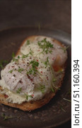 making bruschetta with cream cheese and poached egg. Стоковое видео, видеограф Julia Lavleis / Фотобанк Лори