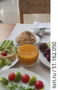 Setting of breakfast includes coffee, fresh orange juice, eggs on table in hotel restaurant Breakfast with coffee surrounded by various food Breakfast Buffet Concept, Breakfast Time in Luxury Hotel. Стоковое видео, видеограф Zita Khasanova / Фотобанк Лори