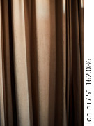 curtain drape of fabric hanging on the window. Стоковое фото, фотограф Наталия Кирсанова / Фотобанк Лори