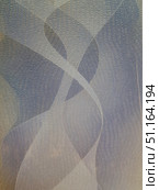 Abstract pattern on a relief surface. The texture is made in the form of many small wavy lines, creating the effect of skin or scales. Soft play of light and shadow in gray-blue and beige shades are noticeable in the background, forming abstract figures and smooth forms. The image resembles a combination of textiles, decorative plaster or artistic background, suitable for use as a template, wallpaper, design material or abstract background for presentations and graphic projects. Стоковое фото, фотограф Анна Кривицкая / Фотобанк Лори