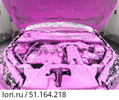 Cleaning the car engine with a special chemically active foam. Washing the engine at a car wash. Стоковое фото, фотограф Владислав Тригуб / Фотобанк Лори
