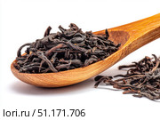 Dry black tea leaves in a wooden spoon isolated on white background. Pile of Dried fermented tea. Black Tea Leaves Heap. Close Up, Macro. Texture. Copy Space. Dried Tea. Abstract Food Drink Backdrop. Стоковое AI-изображение, AI-художник Марина Демидюк / Фотобанк Лори