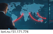 A professional examines global trade flows on a high-tech display in an innovative work environment. Стоковое AI-видео, аниматор Данила Большаков / Фотобанк Лори