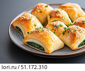 Spinach and feta stuffed spanakopita. Стоковое AI-изображение, AI-художник Татьяна  Бральнина / Фотобанк Лори