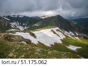 Sunlit cliffs, mountain range in the distance. Стоковое фото, фотограф Саблин Станислав / Фотобанк Лори